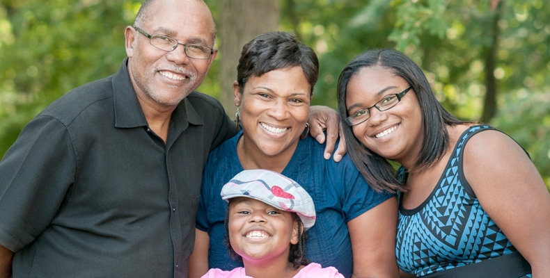 African American Family Posing for a Family Photo in the Park.