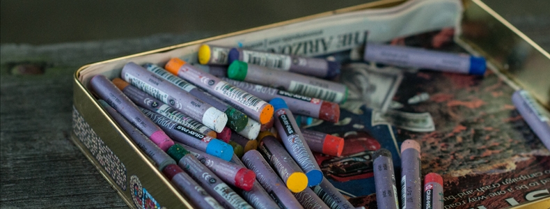 An aluminum of pastel art crayons.